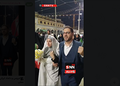 عروس و داماد ایرانی پرچم به دست در کربلای معلی+فیلم
