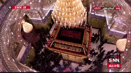 طواف پیکر مطهر رهبر شهید انقلاب به دور ضریح حضرت عباس (ع)