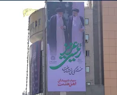 نصب دیوارنگاره شهیدجمهور بر ساختمان شهرداری منطقه ۱۰
