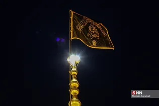 آیین تعویض پرچم گنبد حرم مطهر حضرت معصومه