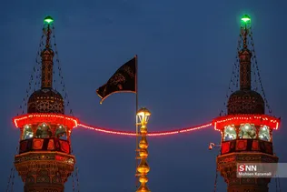 آیین تعویض پرچم گنبد حرم مطهر حضرت معصومه