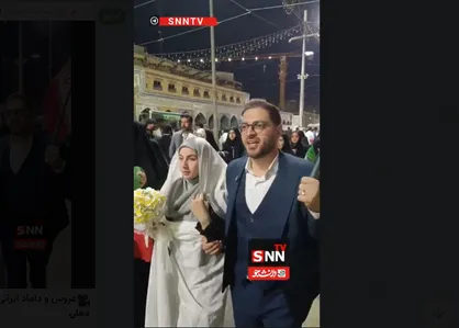 عروس و داماد ایرانی پرچم به دست در کربلای معلی+فیلم