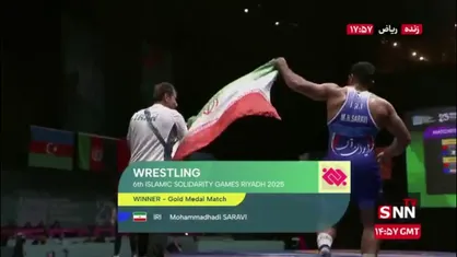 دور افتخار محمد هادی ساروی با پرچم ایران