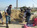 فعالیت جهادگران قرارگاه جهادی دانشگاه آزاد خوزستان در منطقه سیل زده شادگان