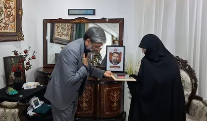 دیدار رئیس کل دادگستری استان تهران با خانواده شهید علی قناعت کار