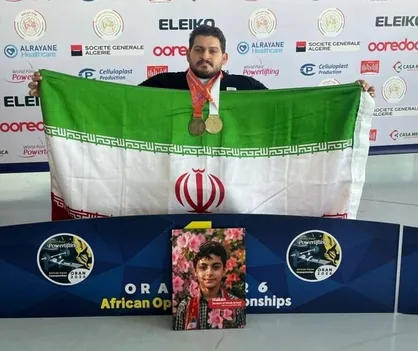 ایزدی مدال&zwnj;های طلا و برنز خود را به شهید ماکان نصیری اهدا کرد