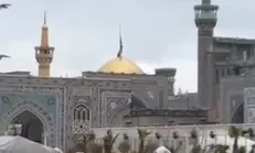 پرچم گنبد مطهر امام رضا (ع) همزمان با پایان شب‌های احیا تعویض شد