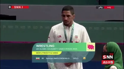مدال طلا بر گردن رحمان عموزاد