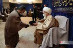 
ملبس شدن جمعی از طلاب به دست آیت الله نوری همدانی
