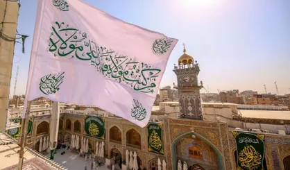 عکس| برافراشته شدن پرچم غدیر و گل&zwnj;آرایی ضریح در حرم امیرالمومنین