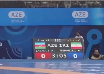 کشتی&zwnj;گیر ایران به دلیل تأخیر از رسیدن به تشک، فینال را از دست داد!