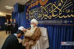 
ملبس شدن جمعی از طلاب به دست آیت الله نوری همدانی
