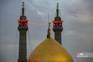 آیین تعویض پرچم گنبد حرم مطهر حضرت معصومه