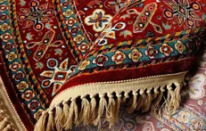 کشف ۷۰ تخته فرش دستباف قاچاق در میان محموله فرش ماشینی +سند