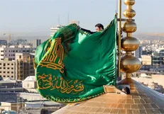مراسم تعویض پوش ضریح و پرچم گنبد همزمان با میلاد امام رضا(ع)
