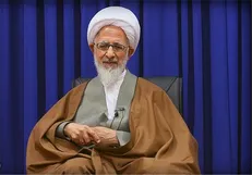 روسری بر سر چوب کردن مقابله با قرآن است