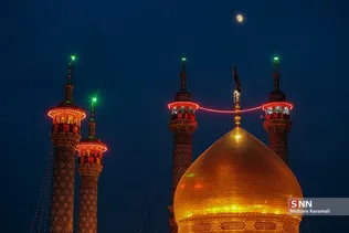 آیین تعویض پرچم گنبد حرم مطهر حضرت معصومه