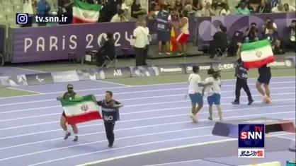 دور افتخار علیپور و اولاد با پرچم ایران در ورزشگاه پاریس
