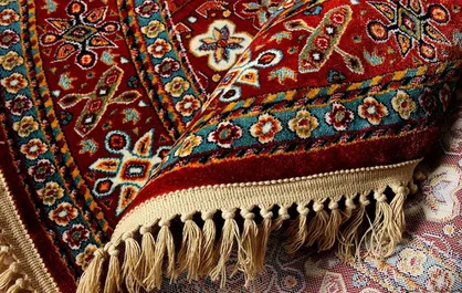 کشف ۷۰ تخته فرش دستباف قاچاق در میان محموله فرش ماشینی +سند