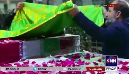 متبرک کردن تابوت شهدای خدمت به پرچم امام رضا (ع)