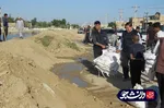 فعالیت جهادگران قرارگاه جهادی دانشگاه آزاد خوزستان در منطقه سیل زده شادگان