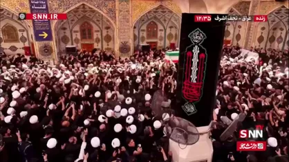 پیکر رهبر شهید انقلاب روی موج دستان عزاداران عراقی در حرم امیرالمومنین(ع)